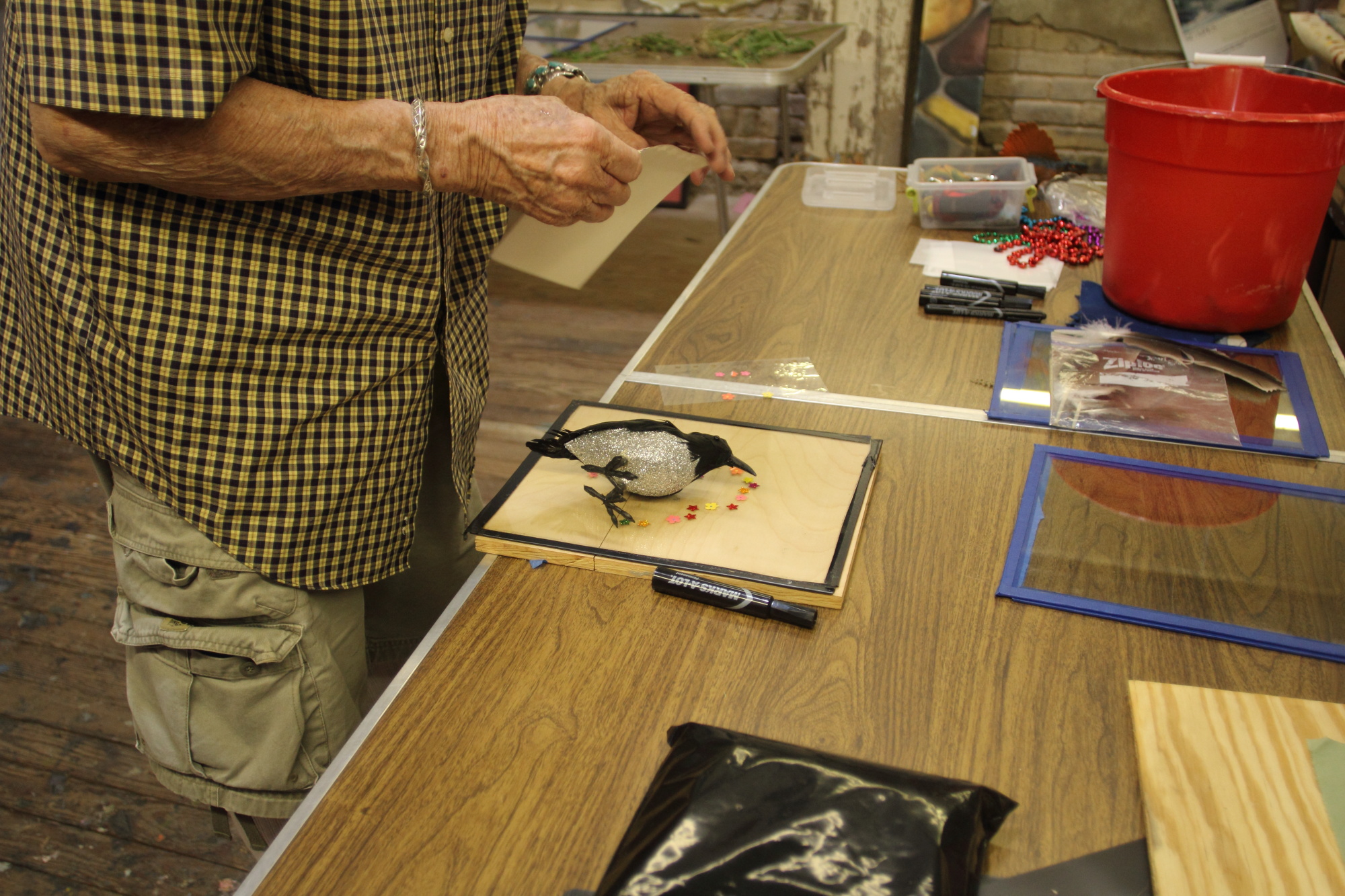 Aubrey designing his bird flag