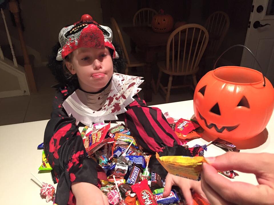 Every year we separate the booty into piles, photograph it, then stash it away &amp; end up maybe eating 5% of it total